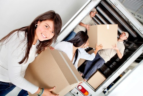 Careful loading of boxes and furniture into a moving van